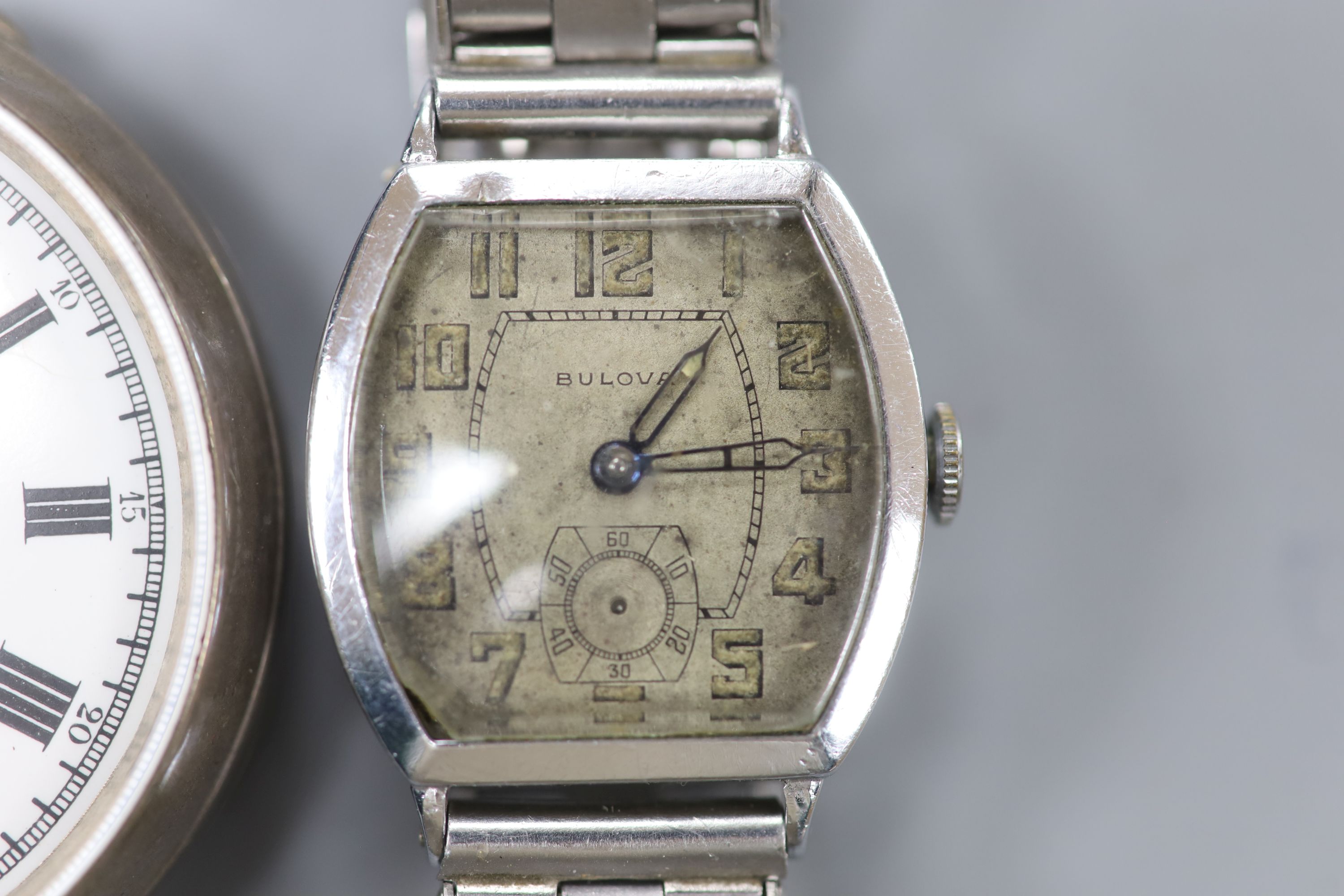 A 1930s Bulova plated wristwatch on later stainless steel bracelet and a Spikins from Dent Accuraspeed silver pocket chronograph (2)